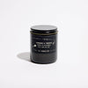 P.F. Candle Co. Teakwood & Tobacco Celestial Collection candle with a simple white container and minimalistic design.