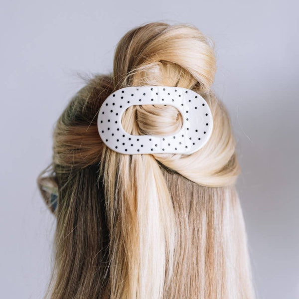 Polka dot Teleties medium flat round hair clip with black and white pattern, perfect for securing hairstyles.
