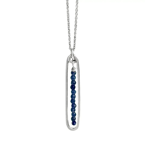Freshie & Zero lyric necklace featuring a blue lapis pendant on a delicate chain, showcasing elegant jewelry design.