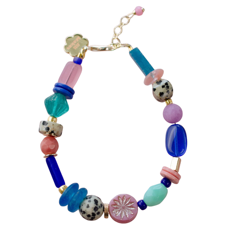 Colorful handmade beaded bracelets in cobalt and pink by Jill Makes, featuring intricate beadwork and vibrant design.