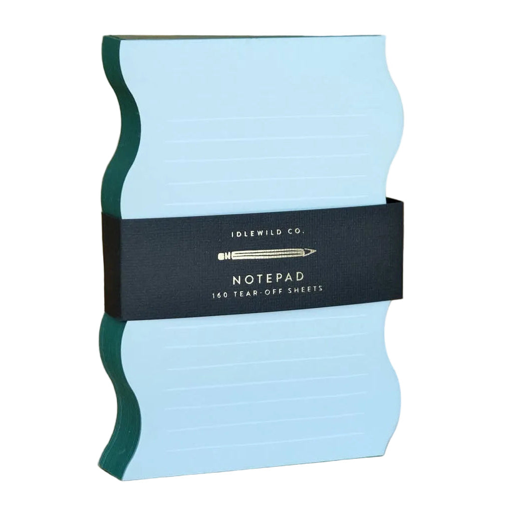 Wavy-shaped Idlewild mint and evergreen edge notepad with lined pages, perfect for note-taking and journaling.