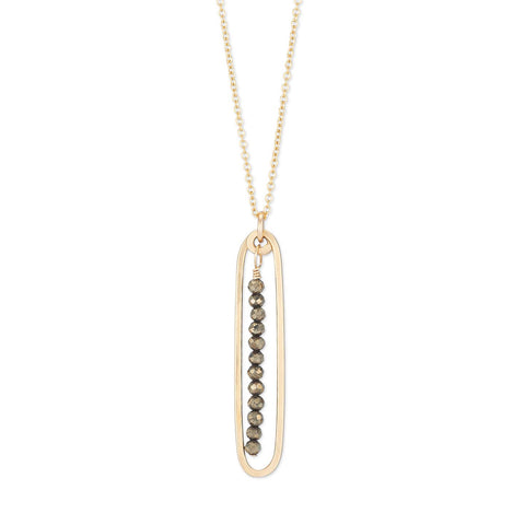 Lyric necklace with pyrite pendant from Freshie & Zero featuring a delicate chain and shimmering metallic stone.