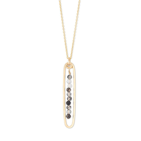 Freshie & Zero lyric necklace featuring black tourmaline quartz pendant on a delicate chain, showcasing a stylish jewelry piece.