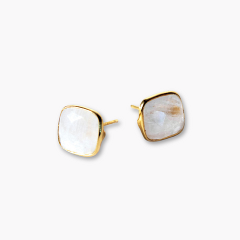 Crystal Quartz cushion cut gold stud earrings by Nude San Francisco featuring sparkling gemstone and sleek gold setting.