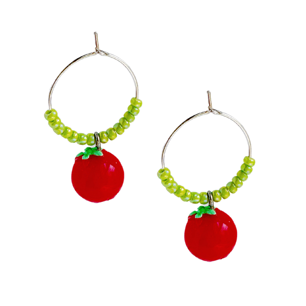 Freshie & Zero tomato earrings featuring small, vibrant red tomato charms hanging from silver hooks.