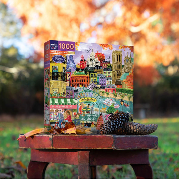 Colorful Paris in Autumn 1000-piece puzzle by eeboo featuring a scenic cityscape with fall foliage and iconic architecture.