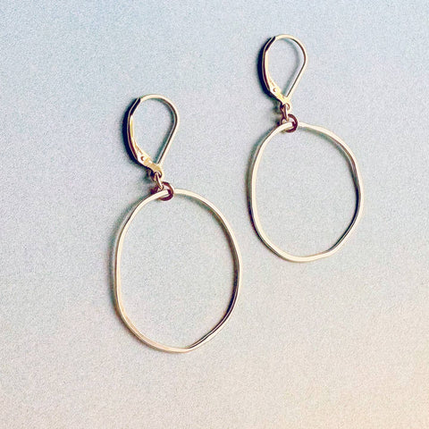 Freshie & Zero Orbita earrings, silver hoop earrings with intricate textured design, stylish jewelry accessory.