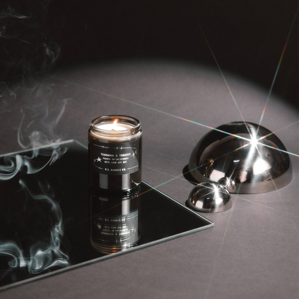 Teakwood and Tobacco candle from P.F. Candle Co. Celestial Collection, featuring a glass jar candle with a natural wood and tobacco scent.