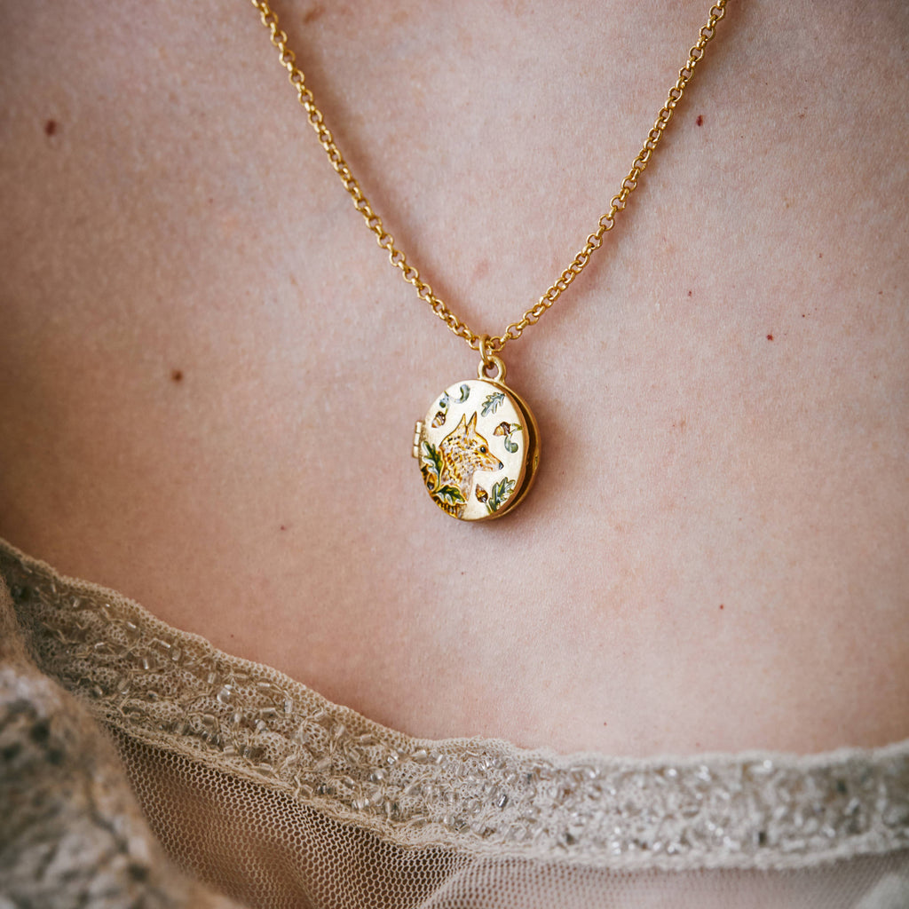 Fox & Acorn vintage-style enamel locket necklace by Fable England, featuring intricate fox and acorn design on a delicate chain.