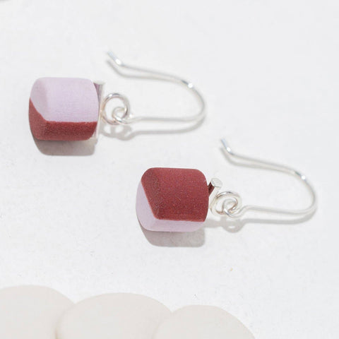 Twenty Two West Pennsylvania Avenue earrings in lavender and plum dip with elegant drop design.