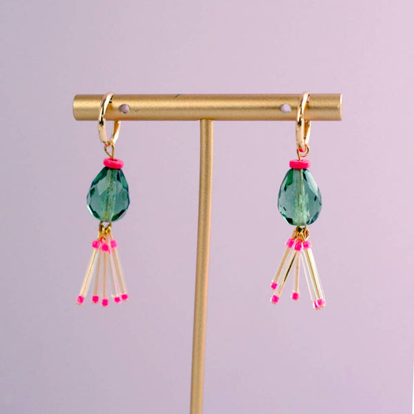 Hot pink and green fringe earrings by Jill Makes, featuring bold colorful tassels and statement jewelry design.