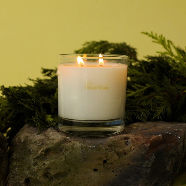Dilo Hinoki Sesame Candle in a glass holder, scented candle with a natural wood and sesame aroma, suitable for relaxation.