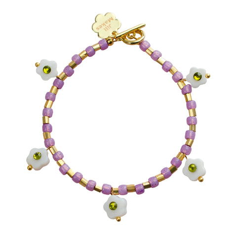 Willow Flower Charm Bracelet by Jill Makes featuring delicate floral charms on a silver chain, perfect for elegant jewelry styling.