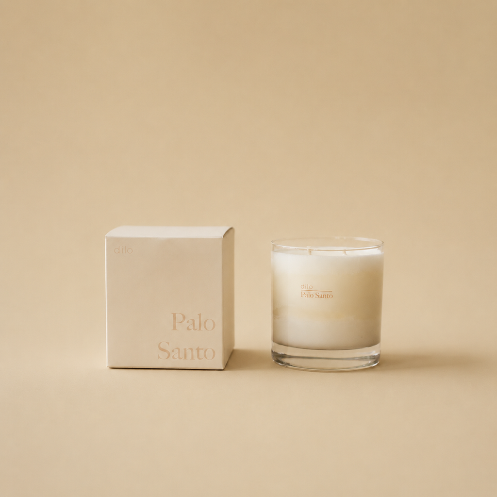 Dilo Palo Santo candle in a glass holder, featuring a natural wooden wick and calming scent, part of candles and incense collection