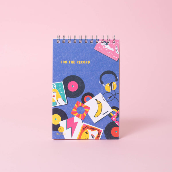 Egg Press Manufacturing 4x6" blank spiral notepad with white pages and colorful cover, ideal for writing and note-taking.