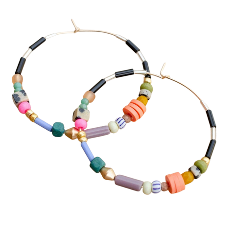 Colorful beaded hoop earrings by Jill Makes featuring vibrant beads and large hoop design.