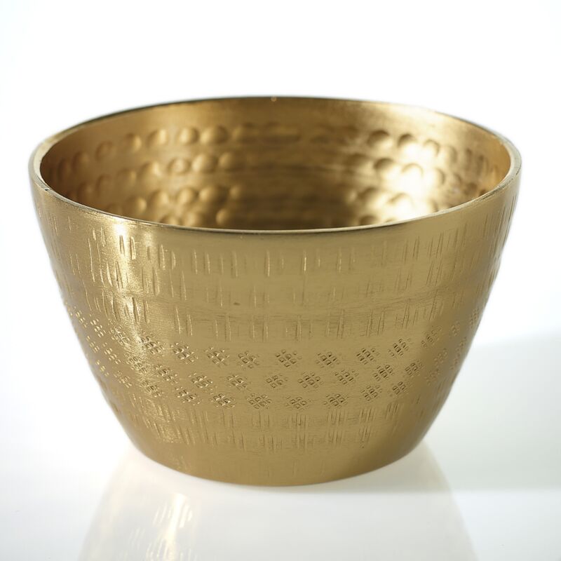 Gold bowl with textured surface on a white background