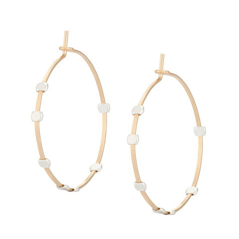 Medium minimalist Cosmos Dotted Hoop earrings by Freshie & Zero, featuring a delicate hoop with dotted design on a white background.