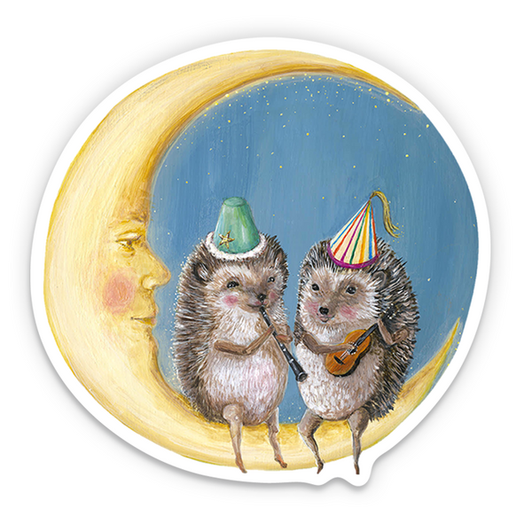 Sticker of two hedgehogs playing instruments on a moon with a face, wearing party hats.