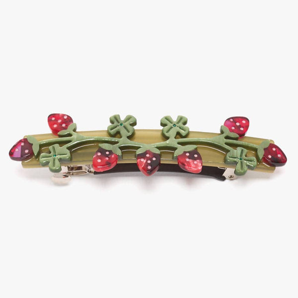 Barrette with strawberry and leaf design on a white background