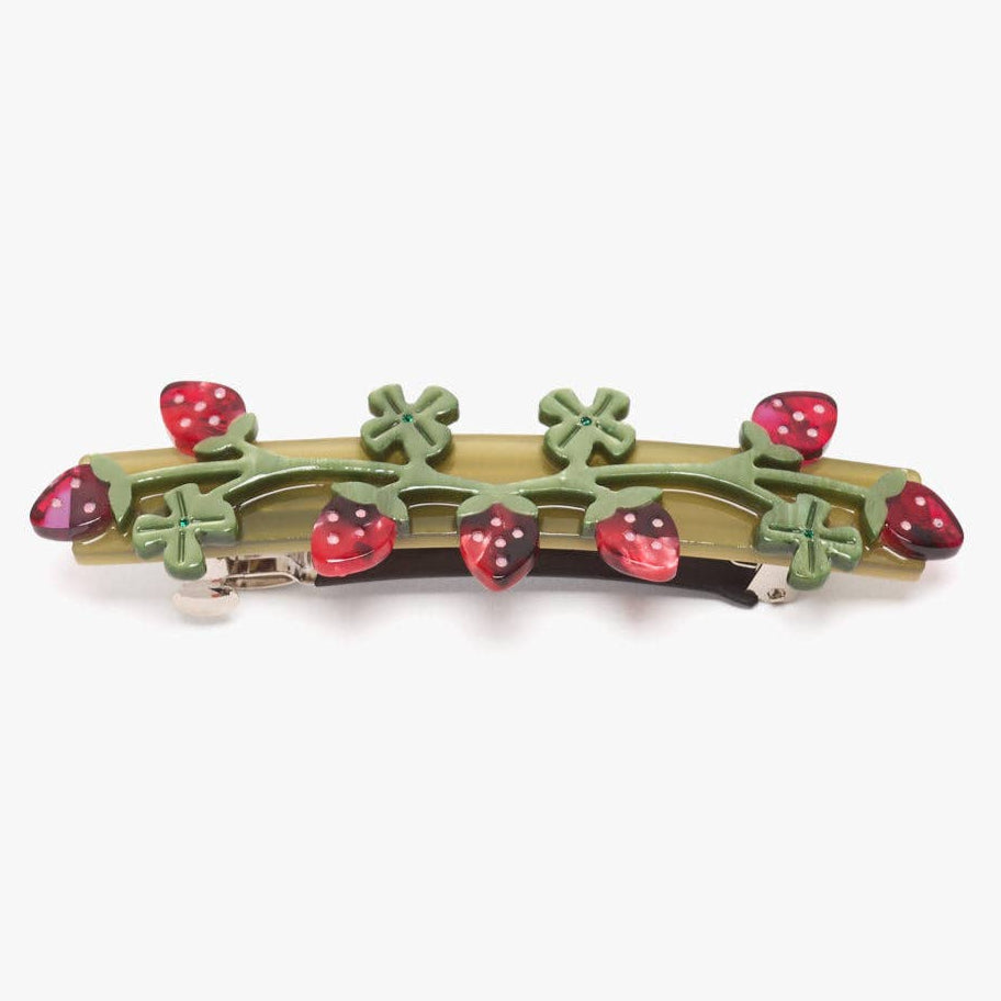 Barrette with strawberry and leaf design on a white background
