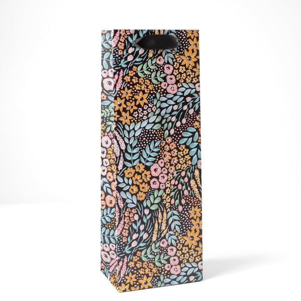 Black floral gift bag from Elyse Breanne Design with elegant floral pattern, perfect for gift wrapping and special occasions.