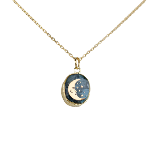 Kyanite moon necklace by Jill Makes featuring a silver chain and a blue kyanite moon pendant, elegant and celestial jewelry piece.