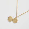 Vintage-style enamel locket necklace by Fable England featuring intricate fox and acorn design, on a delicate chain.