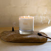 Dilo Palo Santo candle in a glass holder, designed for candles and incense, with a natural wood scent and decorative appearance.