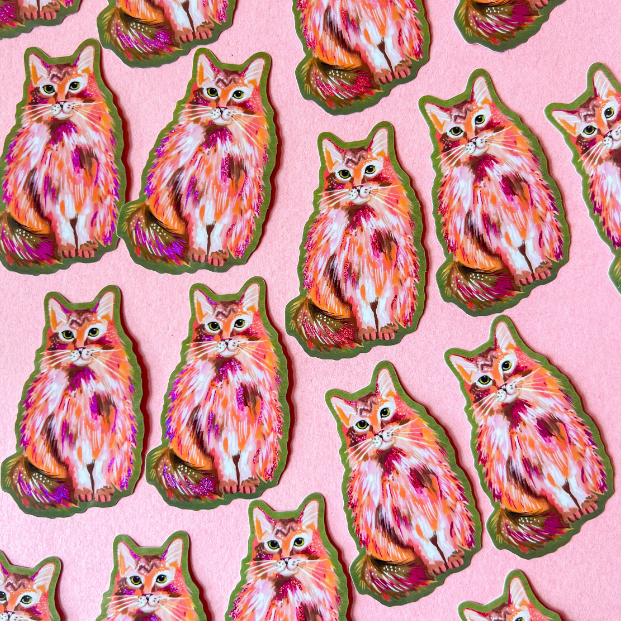 Pink glitter kitty sticker by Katie Daisy, featuring a shiny, colorful cat design on a sticker sheet.