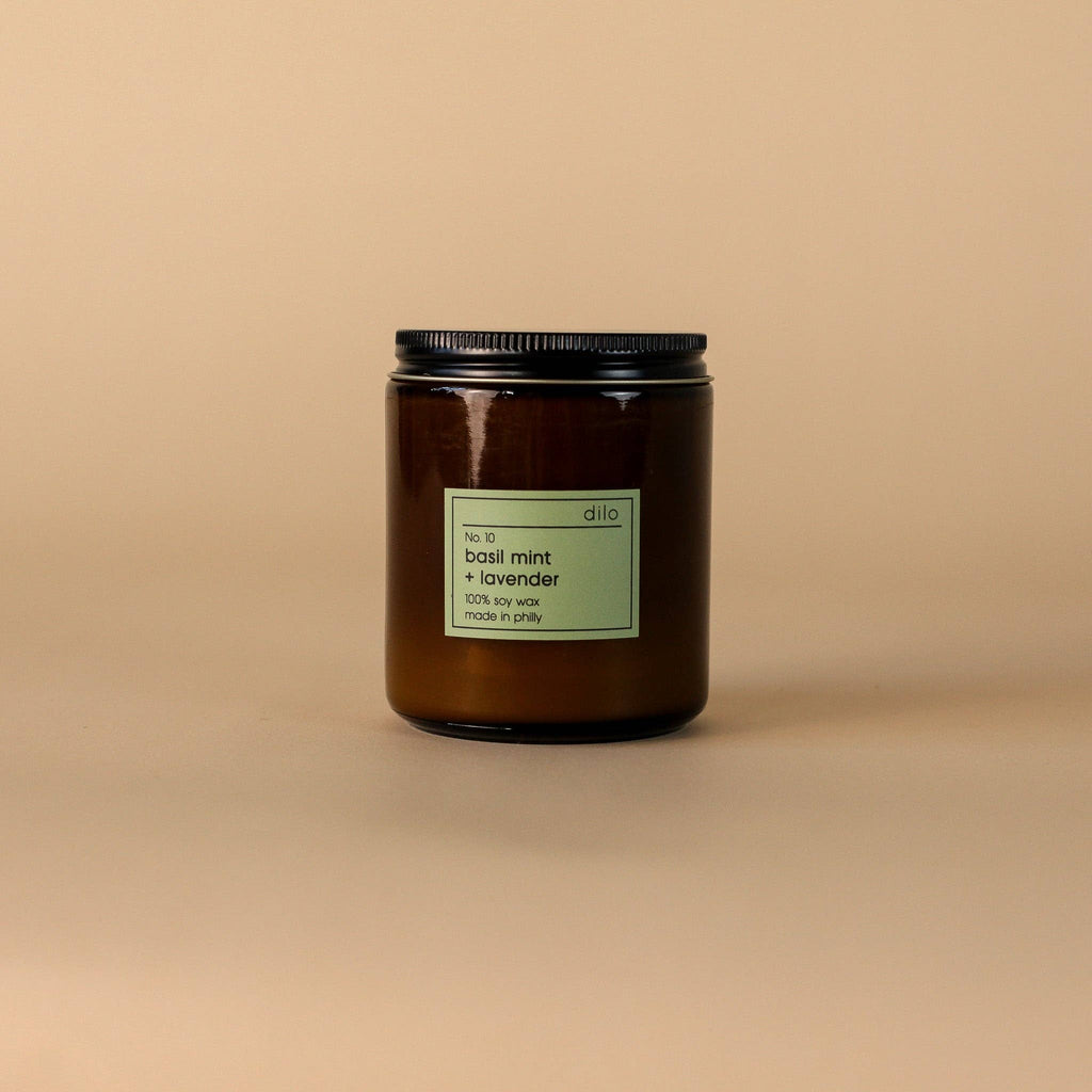 Dilo No. 10 Basil Mint Lavender Candle with a sleek glass holder, showcasing fresh herbs and floral scents.