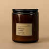Dilo No. 03 Tobacco + Cedar candle with a warm, earthy scent in a glass holder, perfect for creating a cozy ambiance.