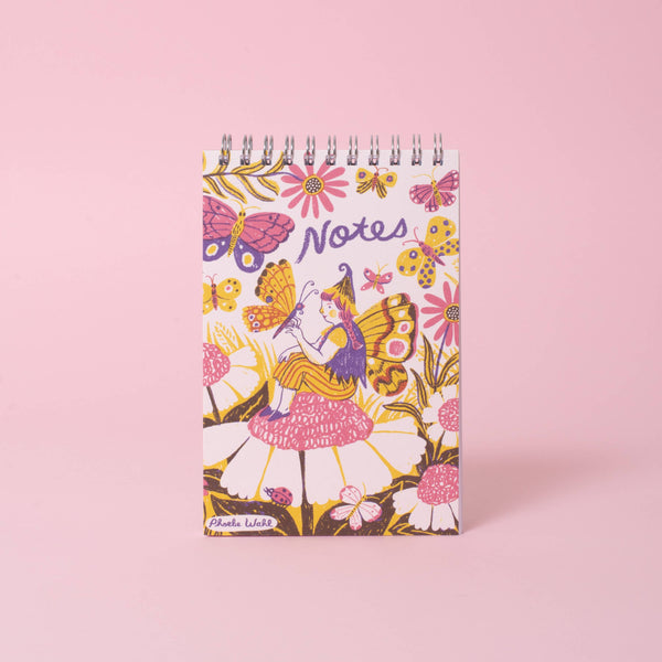 Fairy Garden 4x6-inch blank spiral notepad by Egg Press Manufacturing with floral cover and white pages for note-taking.