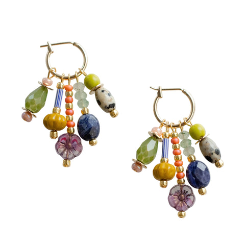 Jill Makes Quinn Charm Beaded Dangle Earrings with colorful beads and silver charms hanging from silver hooks.