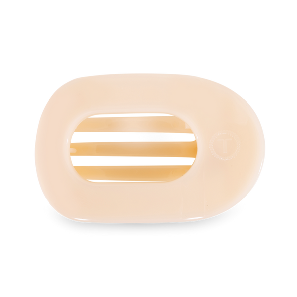 Teleties large flat round hair clip in almond beige, made of flexible hair accessories material, shown from side view.