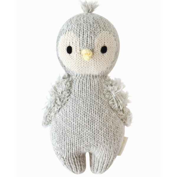 Mini hand-knit baby penguin doll by Cuddle + Kind, soft plush toy with detailed knit stitching, perfect for cuddling.