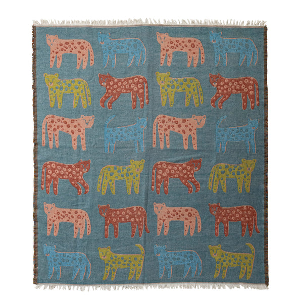 Woven leopard jacquard throw blanket with fringe, featuring a stylish animal print design by Creative Co-Op.