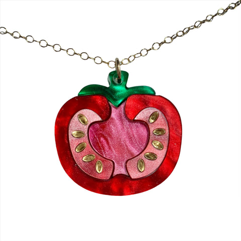 Seeded tomato necklace by Elise Design Company, featuring a delicate pendant with seed details, styled on a chain.