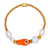 Bracelet with orange fish charm and colorful beads on a white background