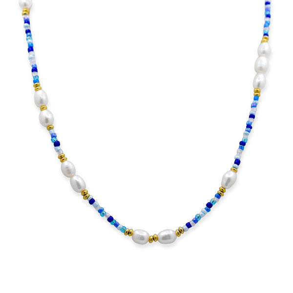 Necklace with pearls and blue and gold beads on a white background