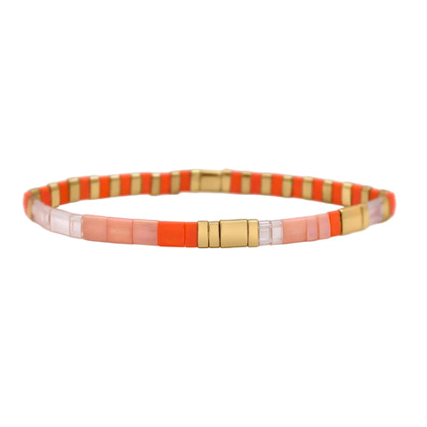 Stia Couture Morse code Tila bracelet featuring small gold beads and a sleek adjustable design on a white background.