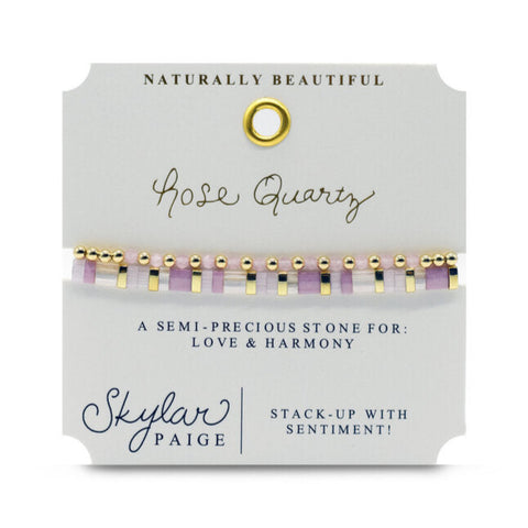 Set of healing stone bracelets featuring pink rose quartz beads, crafted by Stia Couture, displayed on a neutral background.
