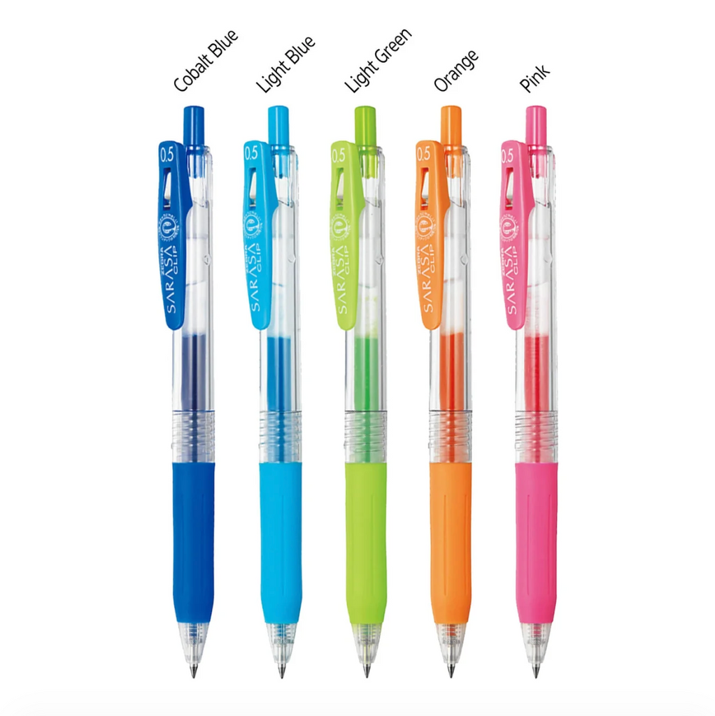 Six Sakura gel pens in different colors are lined up on a white background with color names above each pen: Cobalt Blue, Light Blue, Light Green, Orange, Pink, and a darker blue variant.