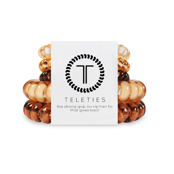 Set of five Teleties coil hair ties in mixed sizes, versatile hair accessories by TELETIES, shown in various colors on a neutral background.