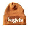 Embroidered silver spider logo on a cozy winter beanie hat, perfect for cold weather from The Silver Spider.