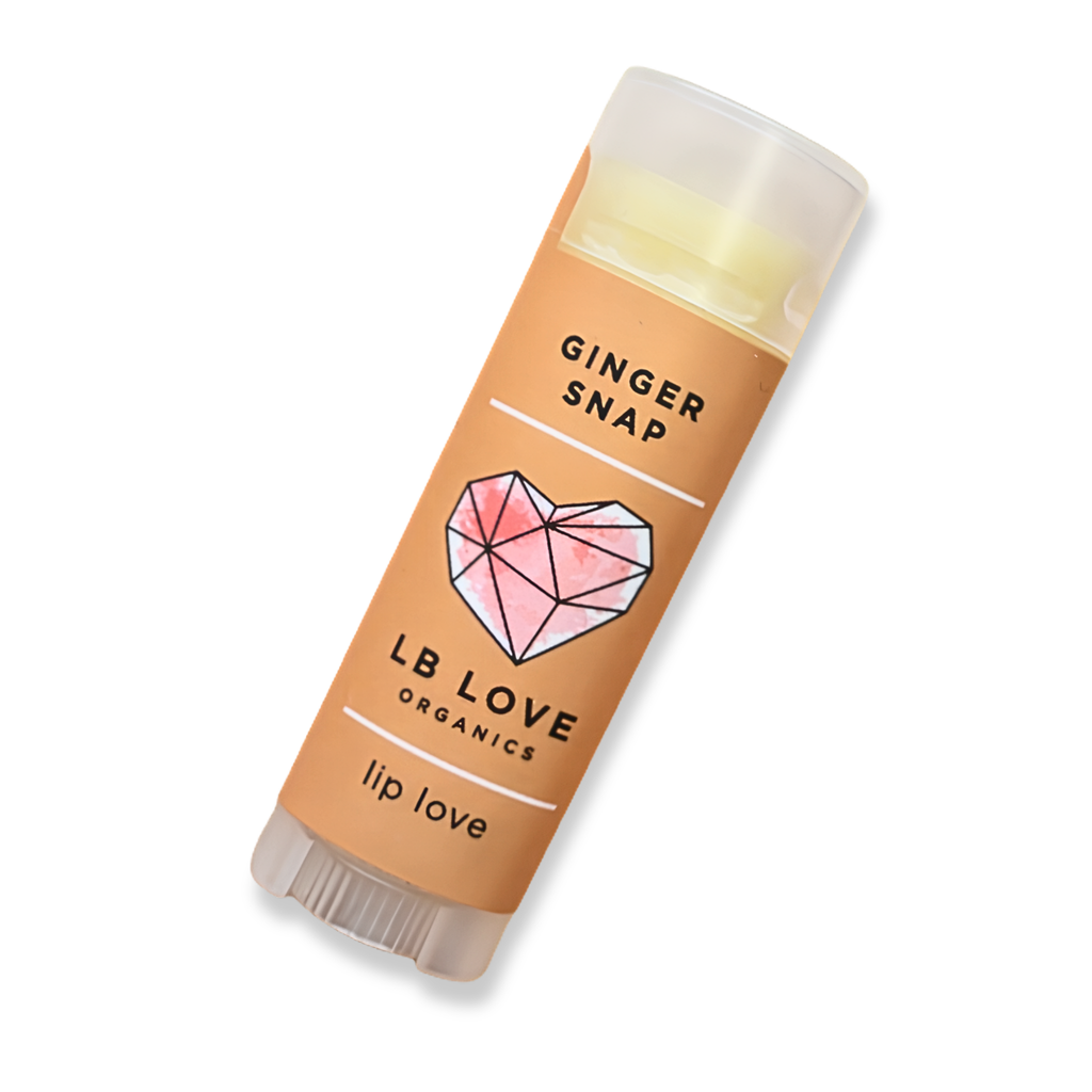 Ginger Snap Natural Lip Balm by LB Love Organics, featuring a sleek tube with a clear cap and ginger flavor branding.