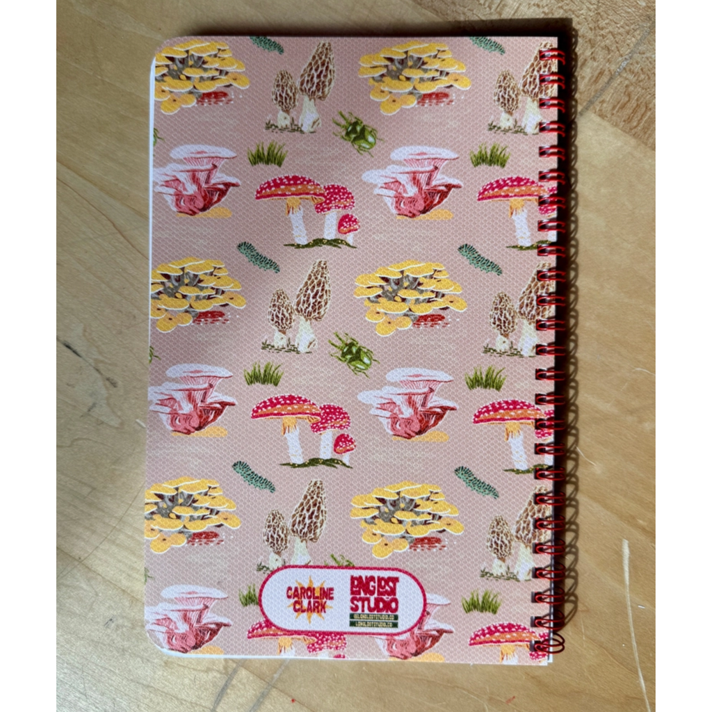 Caroline Clark mushroom pattern notebook with colorful mushroom illustrations on the cover