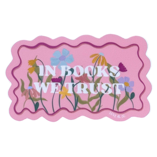 Pink sticker with floral designs with message 'In Books We Trust'