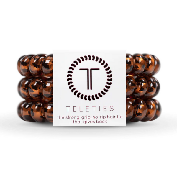 Set of three large TELETIES coil hair ties in vibrant colors, designed for secure and gentle hair styling.