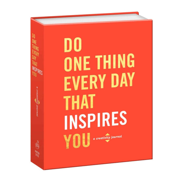 Open creativity journal by Penguin Random House LLC titled "Do One Thing Every Day That Inspires You," with blank pages for daily inspiration.